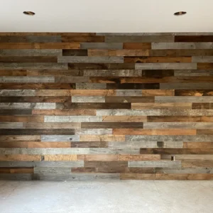 A room with a wall made of Barn Wood Accent Paneling.