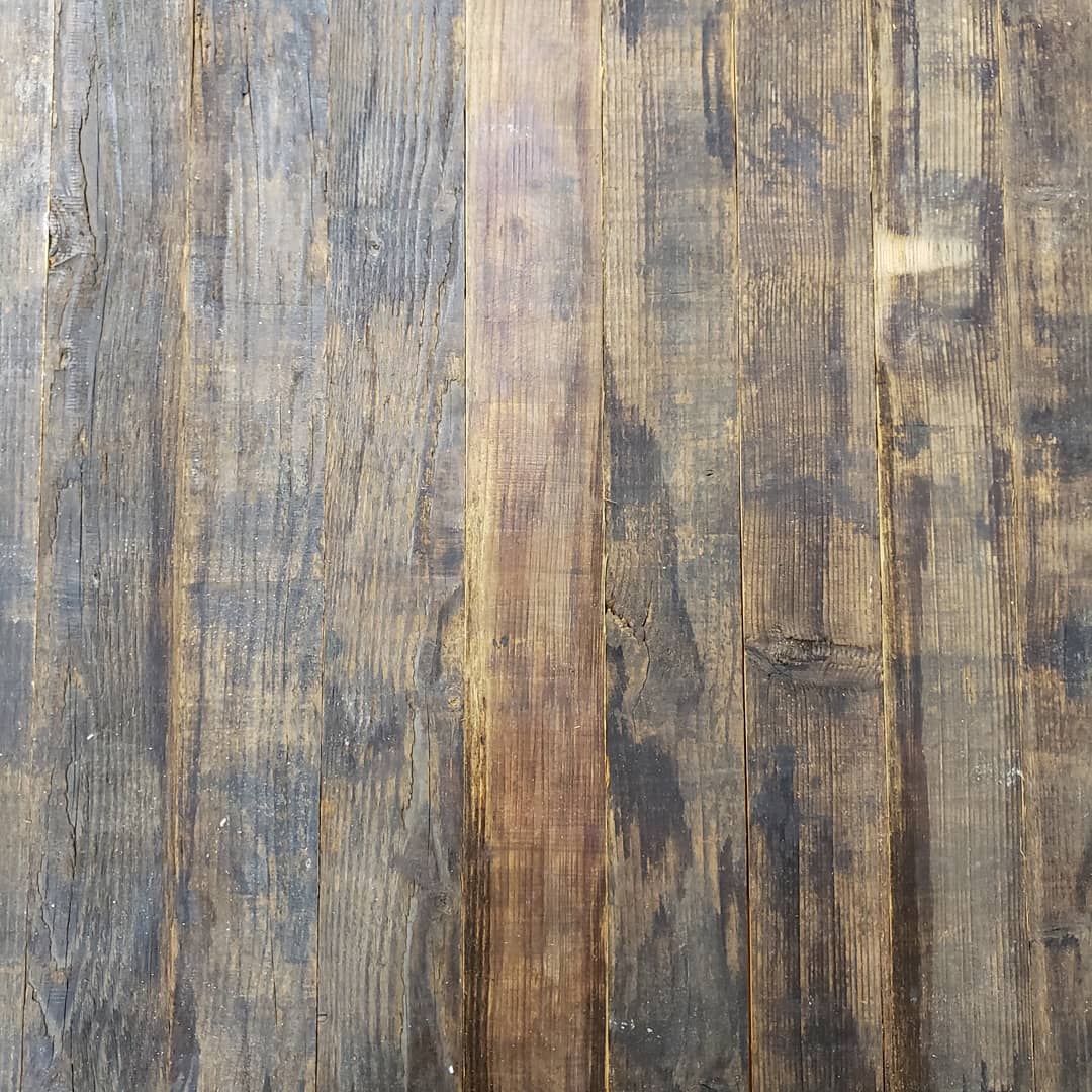 A wooden wall with some wood planks on it